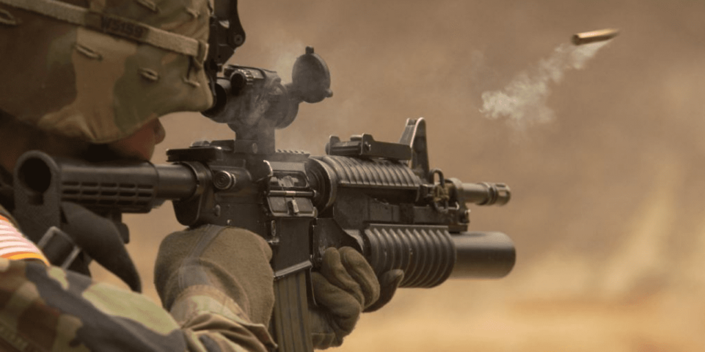 Soldier firing a bullet from a gun